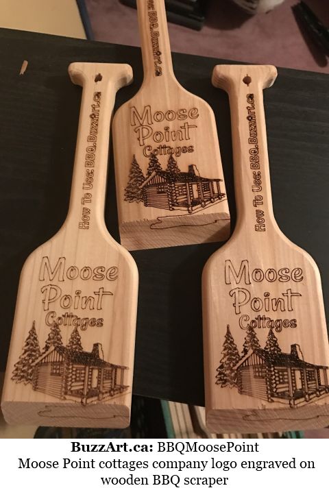 Moose Point cottages company logo engraved on wooden BBQ scraper